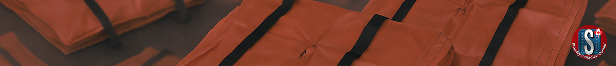 Stacked orange stormwater grate guard mats with black straps, representing Skookum Tools' drain protection and sediment control products for spill containment and stormwater management.